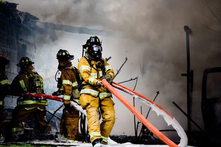 firefighters put out the fire with foam